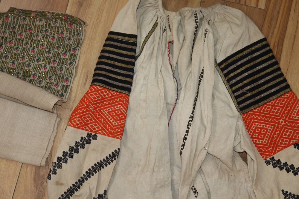 An embroidered Turkish towel, together with a linen embroidered blouse